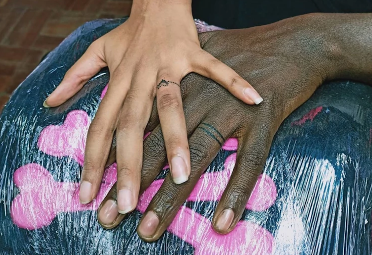 Bien and his wife Chiki Kuruka's tattooed wedding rings