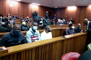 The five accused face charges including premeditated murder. 