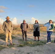 Members of Ukhanyo Farmer Development incubator at one of the farms they have assisted in growing.