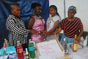 Gamelihle and Sindiswa with their grandchildren.