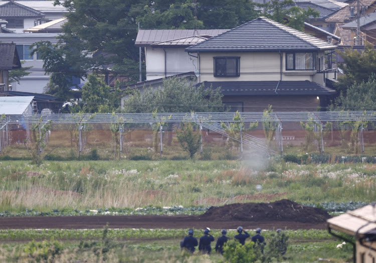 Police officers surround the scene of a stabbing and shooting incident in Nakano, Nagano Prefecture, central Japan, in this photo taken by Kyodo on May 26 2023. Picture: Mandatory credit Kyodo/via Reuters