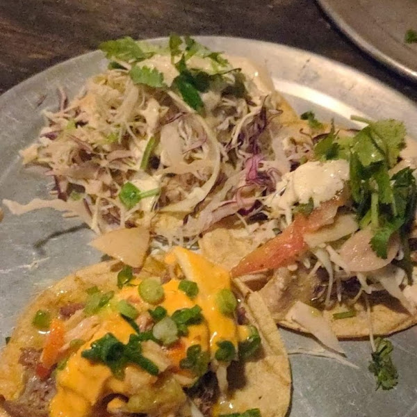 Chicken, fish, and pork tacos