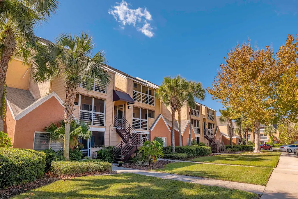 Exterior of an apartment building with palm trees