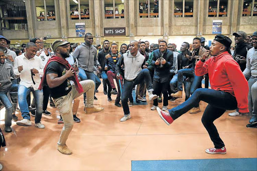 DANCING TO A DIFFERENT TUNE: Students toyi-toyi at Soloman House before Higher Education and Training Minister Blade Nzimande’s announcement earlier this week on the university fee hike. Students at the Witswatersrand were divided on the way forward following Nzimande's announcement of an 8% cap on fee increases, with some calling for an immediate shutdown of the institution Picture: ALON SKUY