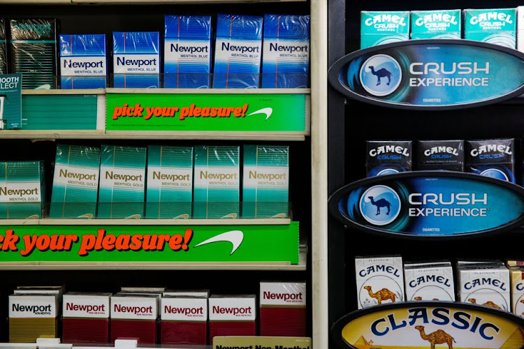 Newport and Camel cigarettes are stacked on a shelf inside a tobacco store in New York July 11, 2014. REUTERS/Lucas Jackson