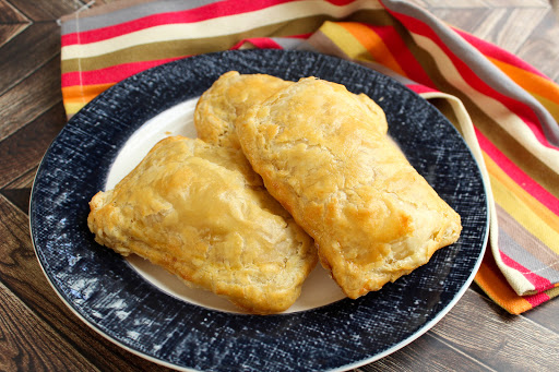 Three Homemade Chicken Hot Pockets on a plate.