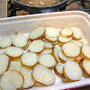 Thumbnail For A Layer Of Sliced Potatoes In A Baking Dish.