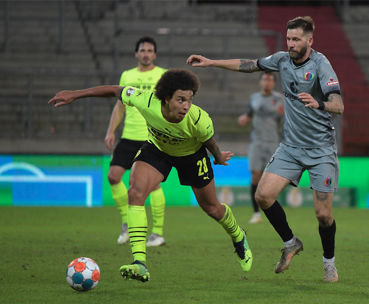 Borussia Dortmund's Axel Witsel in action with FC St Pauli's Guido Burgstaller