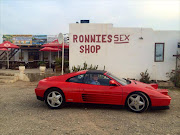 A picture of Cobus Kellermann driving a red Ferrari appears on his Facebook page.