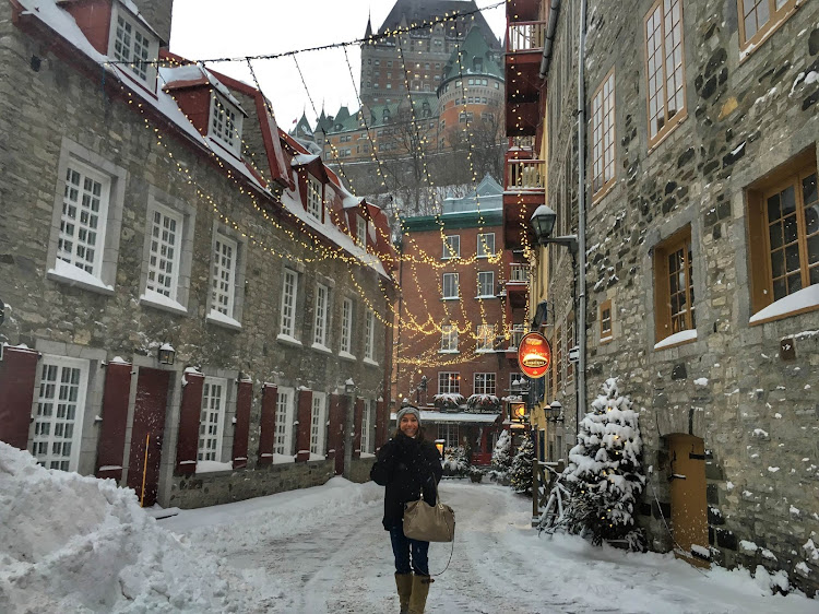  Quebec City looks festive under holiday lights at twilight. 