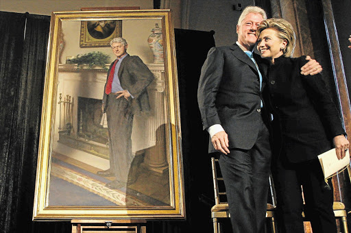 SHADOW OF SINS PAST: Bill and Hillary Clinton at Washington's National Portrait Gallery after Clinton unveiled his portrait