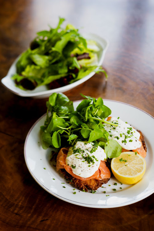 Potato latkes topped with smoked salmon and sour cream.