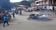 Three people were gunned down, six others including a child were injured and three minibus taxis were torched during taxi violence that erupted in Port St Johns on Tuesday.