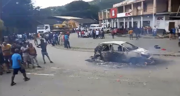 Three people were gunned down, six others including a child were injured and three minibus taxis were torched during taxi violence that erupted in Port St Johns on Tuesday.