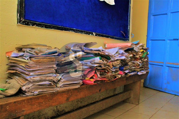 Smudged books inside a muddy classroom at Mathare North Primary School affected by floods, May 3, 2024.