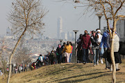 Residents form massive queues, 16 July 20201, outside Alex Mall, 