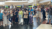 Scores of family members anxiously waiting at OR Tambo International Airport for their loved ones to arrive from war-torn Sudan. 