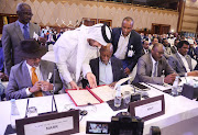 Officials attend a signing agreement for a national dialogue with Chad's transitional military authorities and rebels at Sheraton Hotel in Doha, Qatar August 8, 2022. 