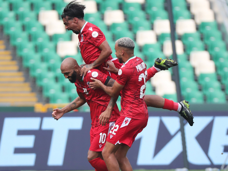 Equatorial Guinea players celebrate scoring against Ginnea Bissau