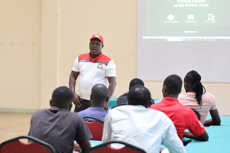 FKF integrity officer Mike Kamure addressing Talanta FC team members during an integrity workshop