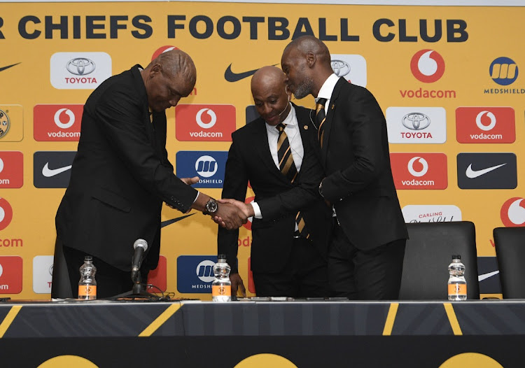 Molefi Ntseki, left, with Arthur Zwane during his appointment last year, while Kaizer Motaung Jnr looks on. The club should have been more forthcoming on Zwane's demotion.