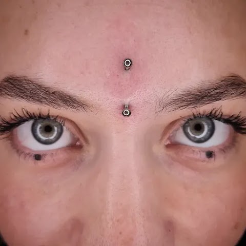 Amygdala Piercing Tattoo