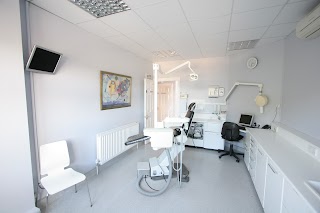 The Dentists - MK Vasant MBE and Dental Associates