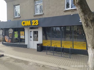 Сім23