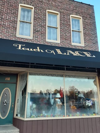 Touch of Lace Inc