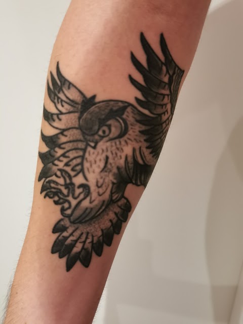 Falling Bird Tattoo Studio