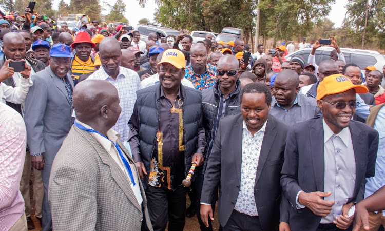 ODM Party leader Raila Odinga and Governor Alex Tolgos flanked by their supporters after he arrived in Elgeyo Marakwet County on Friday, April 1, 2022.