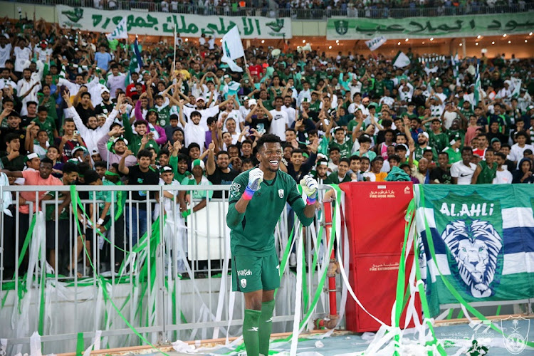 Al-Ahli Saudi goalkeeper Mohammed Al-Rubaie celebrates with the club's supporters after their 3-0 Yelo League win against Al Jabalain at Prince Abdullah al-Faisal Stadium in Jeddah, Saudi Arabia on January 24 2023.