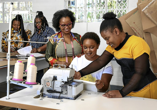 Fezile Mdletshe of the Fezile Fashion Skills Academy with student Slindile Sangweni and mentor Hlengiwe Gumede. Far left, students Nobuhle and Thandeka Khoza.