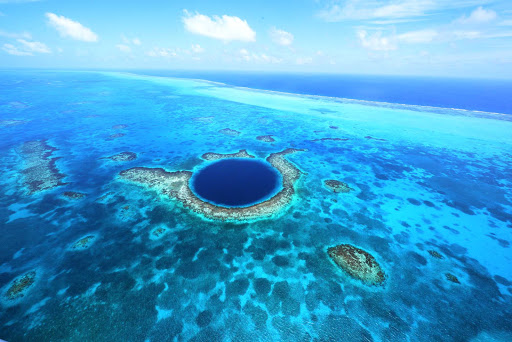 The Great Blue Hole is a large submarine sinkhole off the coast of Belize.