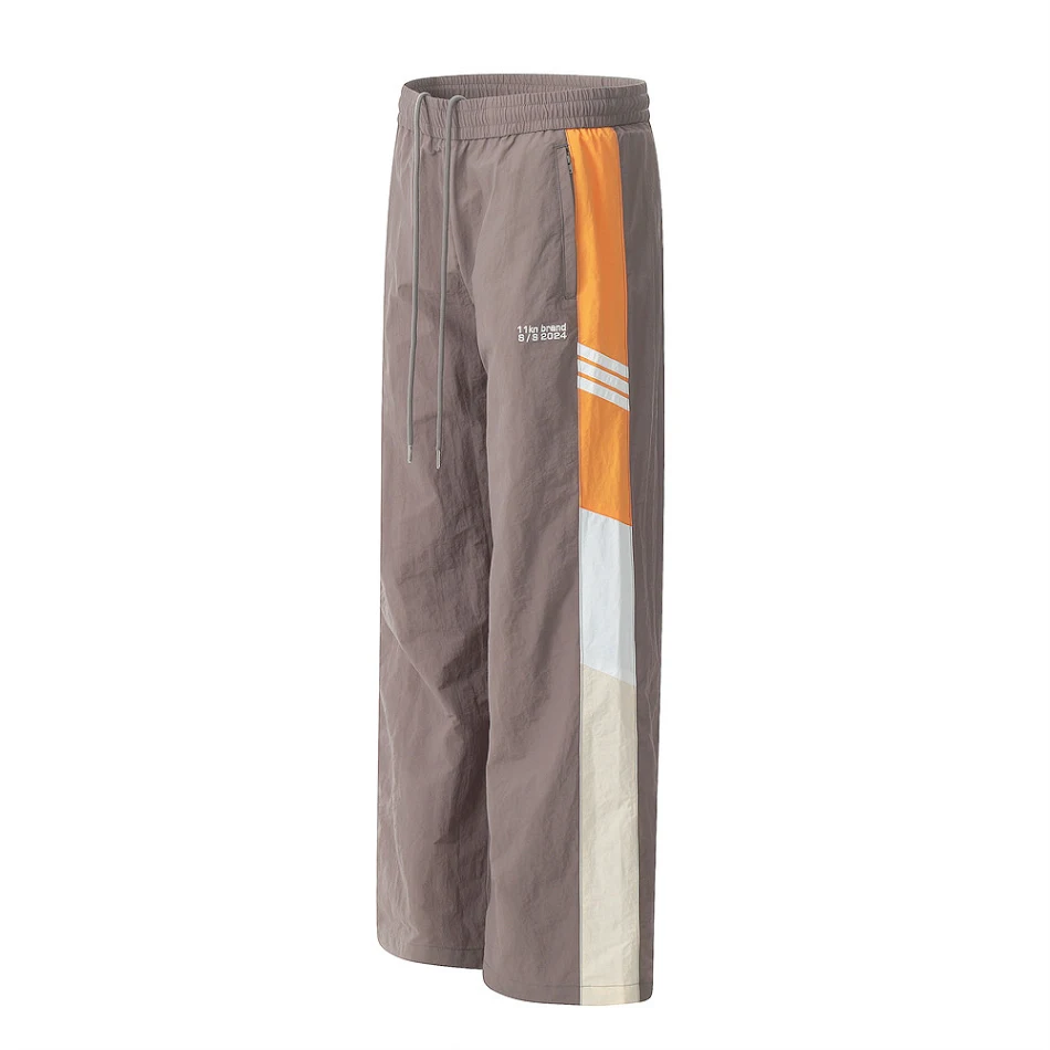 Muške sportske casual pantalone sa blokovima boja Udobne i moderne za svakodnevno nošenje i sportske aktivnosti Savršen stil za vas