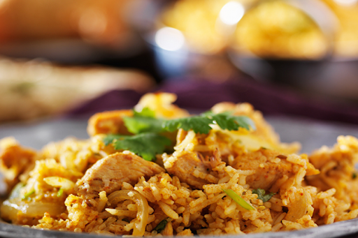 Chicken Dum Biryani Served With Raita