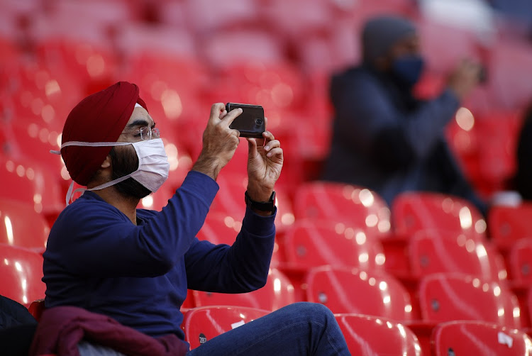 General view of a fan inside the stadium before the match as thousands of fans return to Wembley for FA Cup semi-final as part of coronavirus events trial.