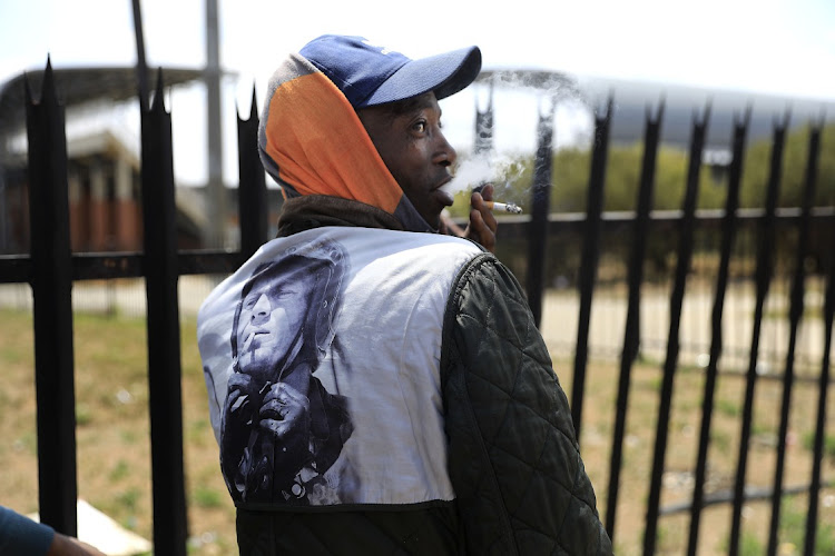 Moalusi Lesito poses for a photograph in front of The Fezile Dabi Stadium. He spoke about corruption in the area.