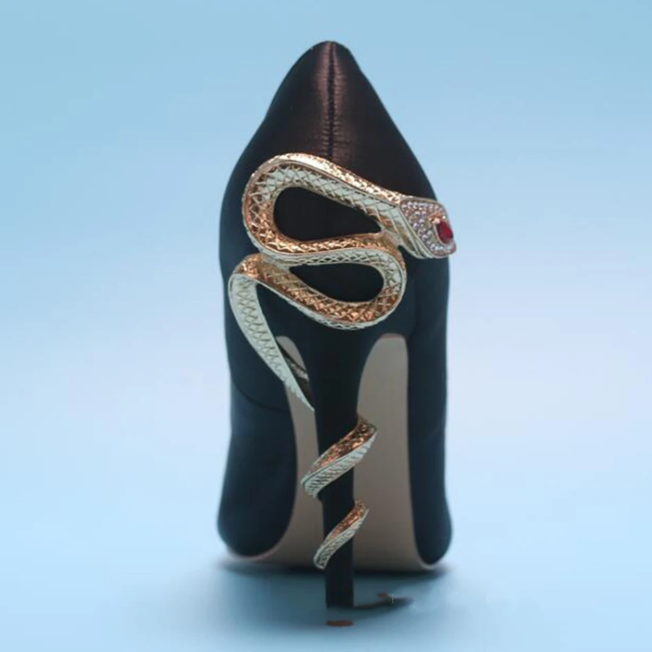 Cobra Heel pointed toe low-cut patent leather high heels. Elevate your style with these elegant and sophisticated heels 