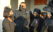 Hillary Gardee's brother, Noble, with relatives at his sister's funeral in Mbombela on May 7 2022.