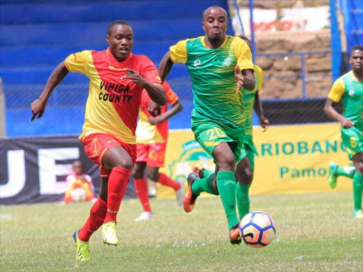 Vihiga United’s Dennis Ombeva challenges Kariobangi Sharks’ Eric Kapaito / FILE