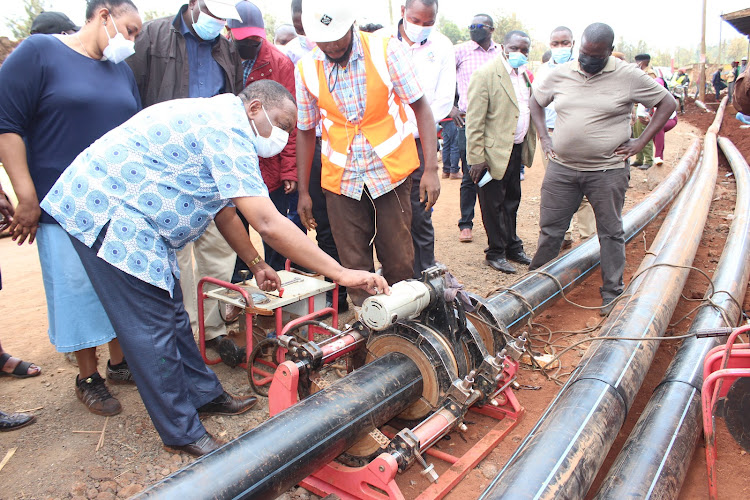 Water Principal Secretary Joseph Wairagu inspecting pipes that will be used to connect water to homes in Kigumo constituency.