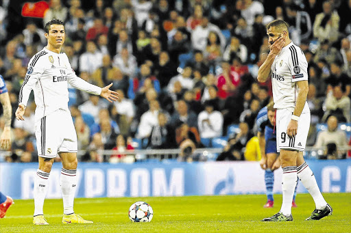 FRUSTRATED: Real Madrid's Portuguese striker Cristiano Ronaldo, left, with teammate Karim Benzema, of France, after Schalke scored during their Champions League match in Madrid on Tuesday