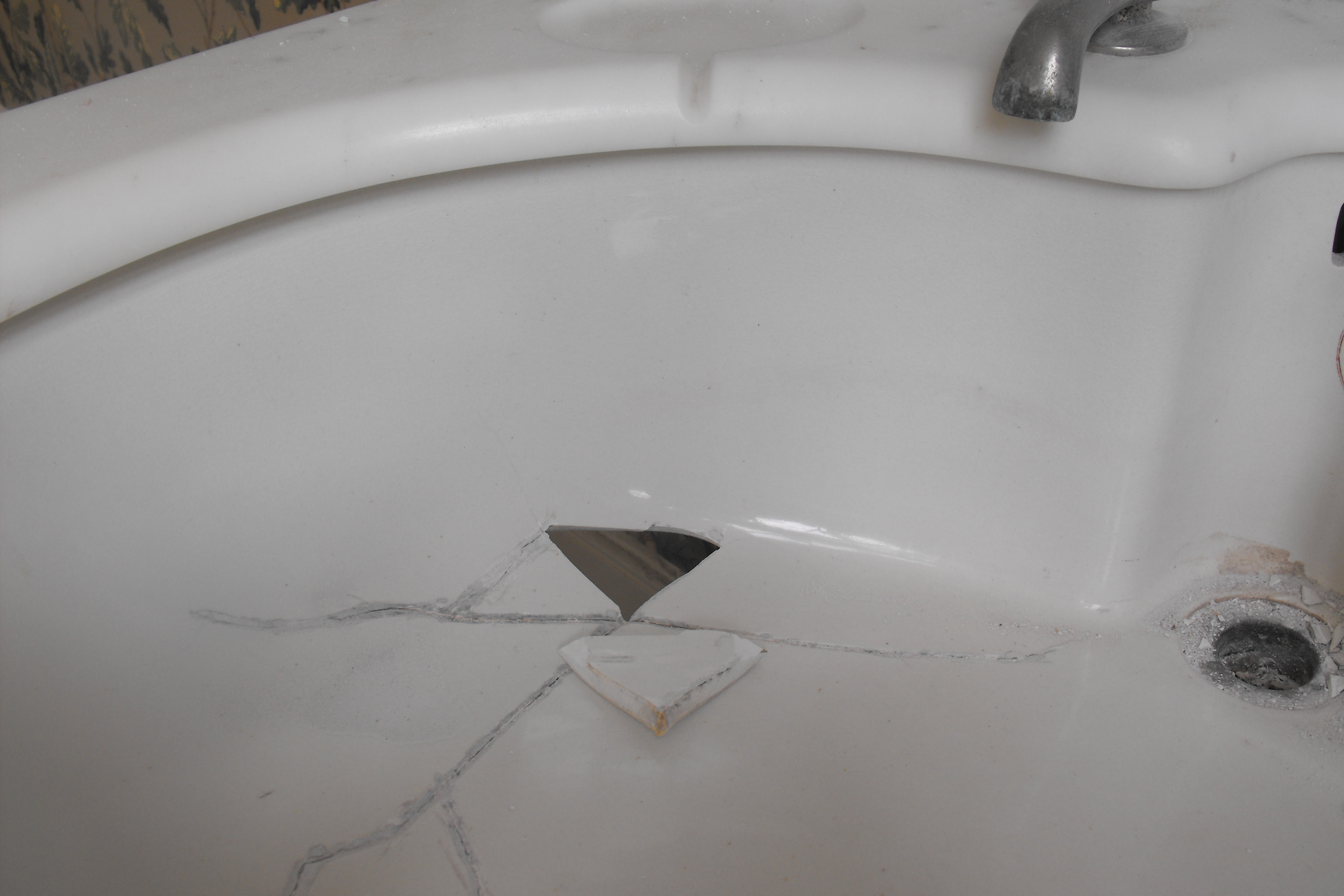 bathroom sink cracks around drain