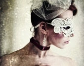 Title: "Masquerade"  Photographic portrait of a woman in a white mask. - SpokeninRed