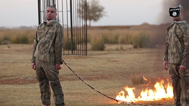One soldier tries to sneak a glimpse of the flames as they make their way up the chain, which is intertwined with flammable material, and eventually set them both on fire