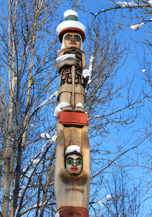 totem pole with snow at the Alaska Native Heritage Center, Anchorage, Alaska