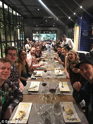 The grateful employees from Poole, Dorset are pictured enjoying dinner on their boss in the Spanish capital last week