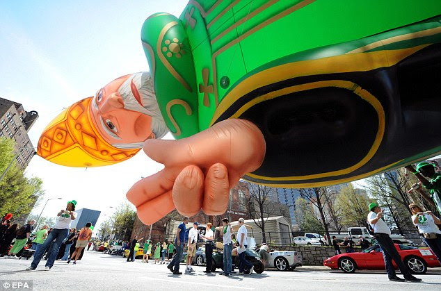 St Patrick himself: A newly inflated St. Patrick helium balloon wafted in Atlanta's streets, waiting its parade debut