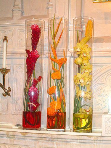 Ginger, Heliconia, and Orchid centerpieces & it could keep Ginger, Heliconia, and Orchid centerpieces & it could keep